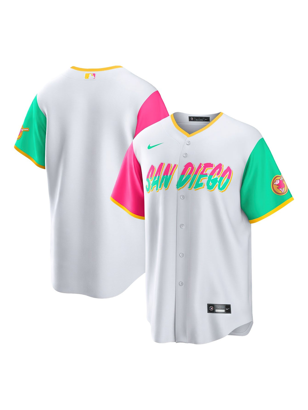 Jersey de béisbol Nike San Diego Padres blanco con mangas rosa y verde y letras multicolores en el pecho.
