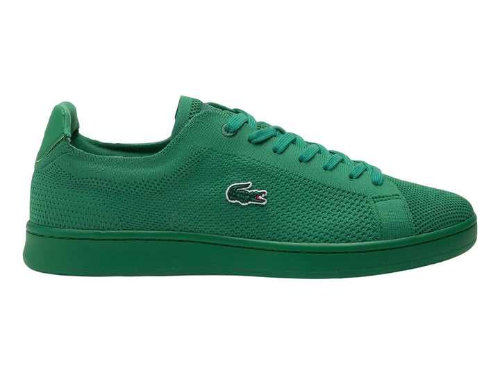 Tenis Lacoste color verde con textura de piqué y suela a juego.