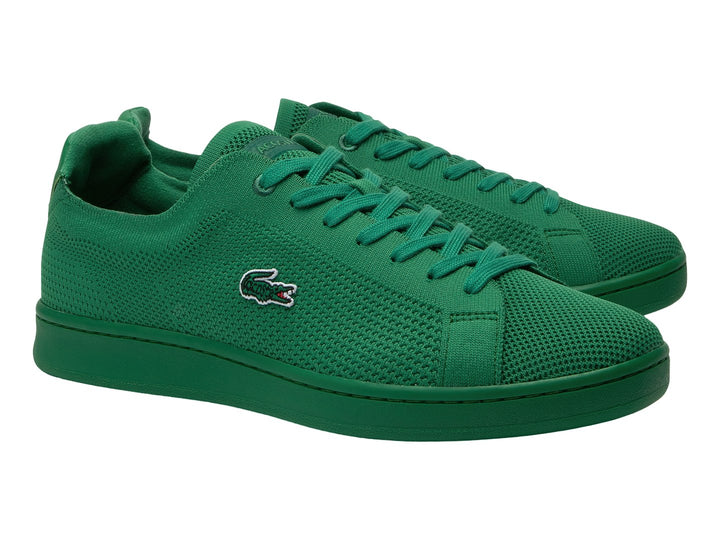 Tenis Lacoste color verde con textura de piqué y suela a juego.
