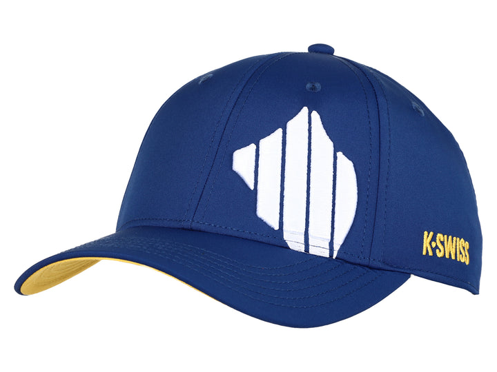Gorra deportiva K-Swiss color azul con logotipo blanco frontal y detalles en amarillo en la visera y lateral.