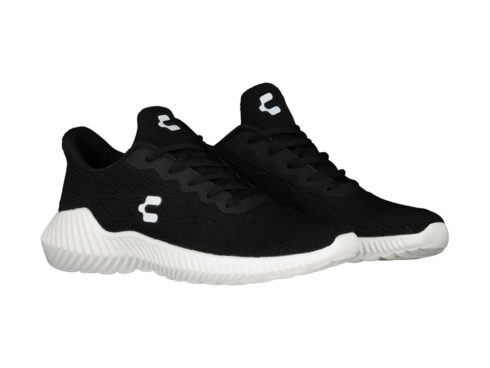 Tenis deportivos Charly de color negro con suela blanca y logo blanco lateral.