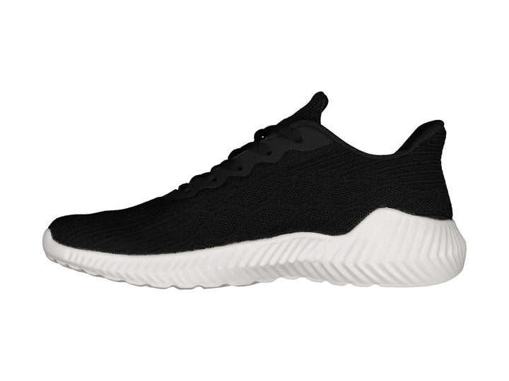 Tenis deportivos Charly de color negro con suela blanca y logo blanco lateral.