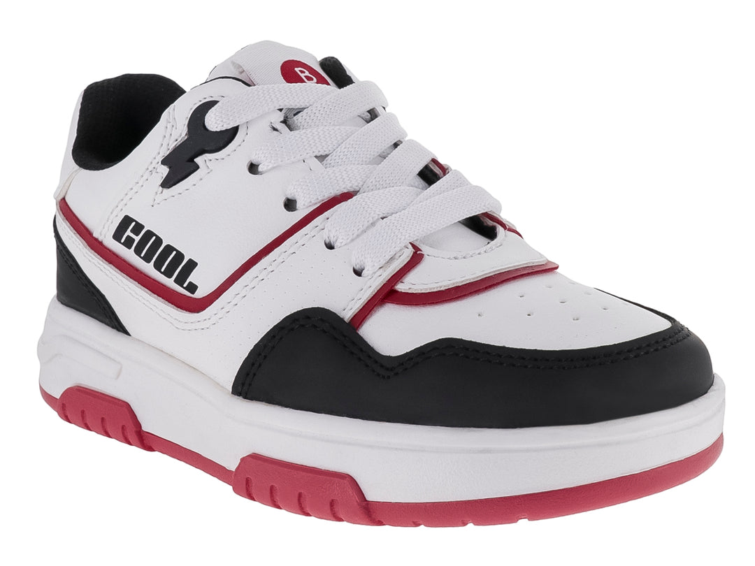 Tenis infantiles blancos con detalles en negro y suela roja, estilo deportivo.