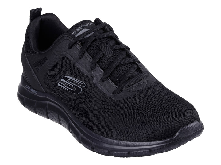 Tenis deportivo Skechers color negro con suela flexible y parte superior de malla transpirable.