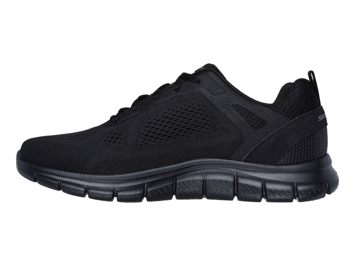 Tenis deportivo Skechers color negro con suela flexible y parte superior de malla transpirable.