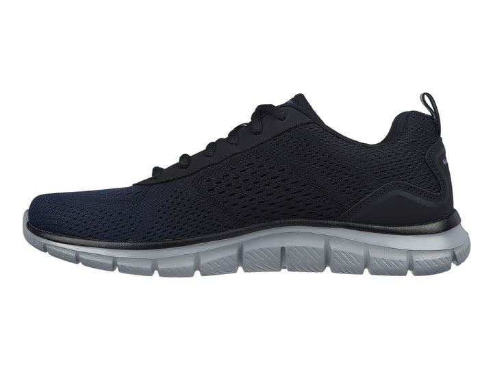 Tenis deportivos Skechers en color azul marino con suela gris y tejido de malla transpirable.