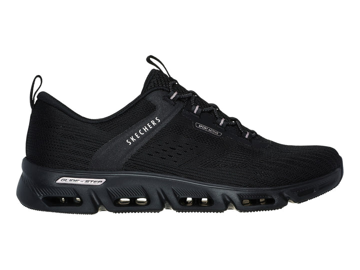 Tenis deportivos Skechers color negro con detalles dorados en la suela y tejido transpirable.
