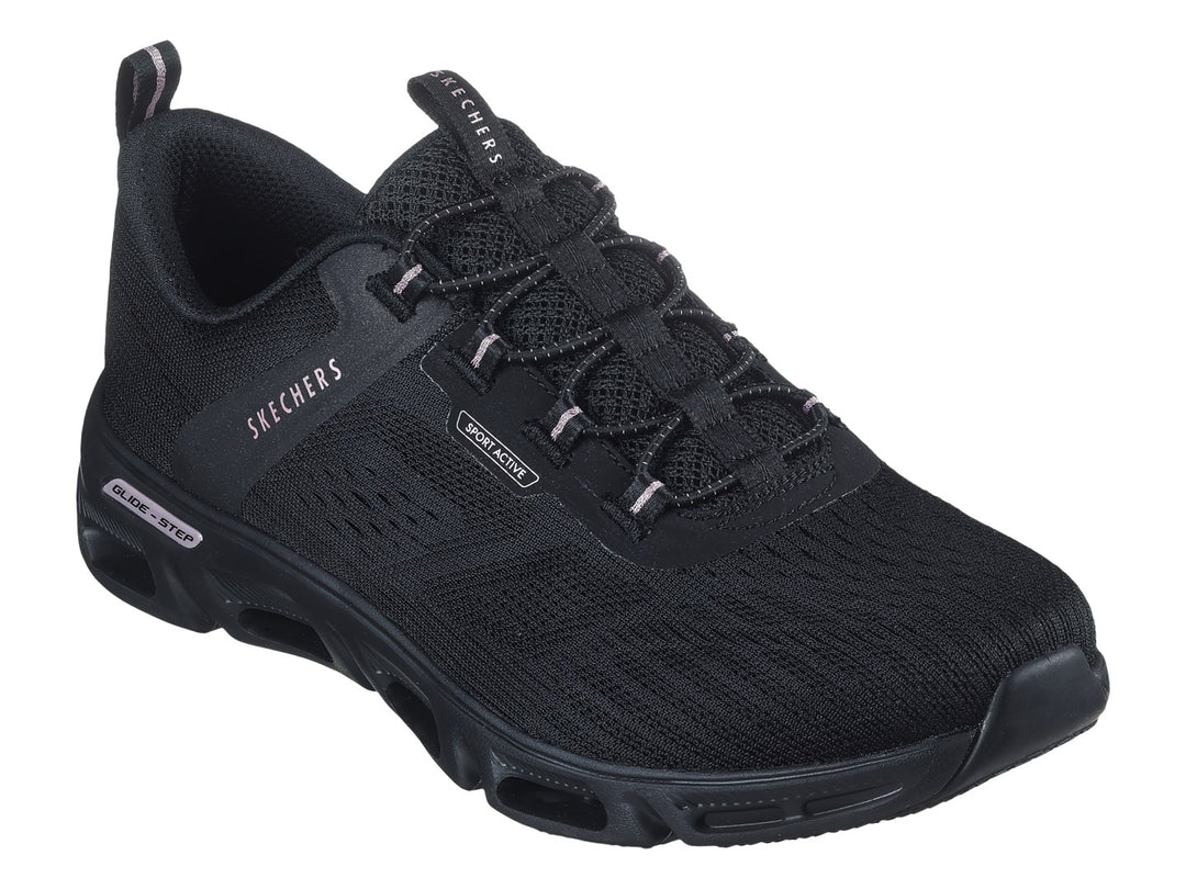 Tenis deportivos Skechers color negro con detalles dorados en la suela y tejido transpirable.