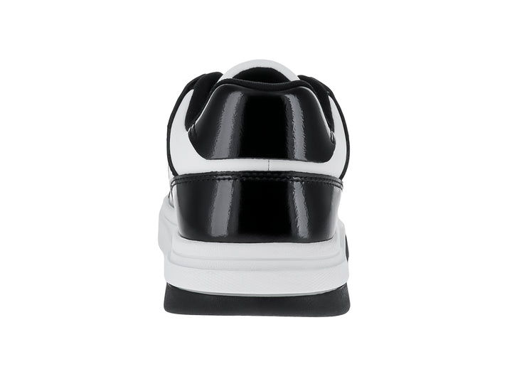 Tenis Tommy Hilfiger modelo The Brooklyn en colores blanco y negro con acabado brillante tipo charol.