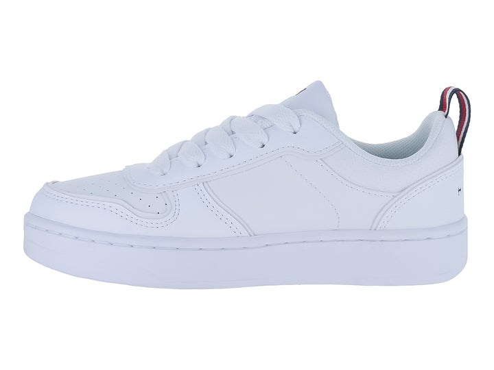 Tenis blancos Tommy Hilfiger de corte bajo con suela plana y detalles tricolores en el talón.