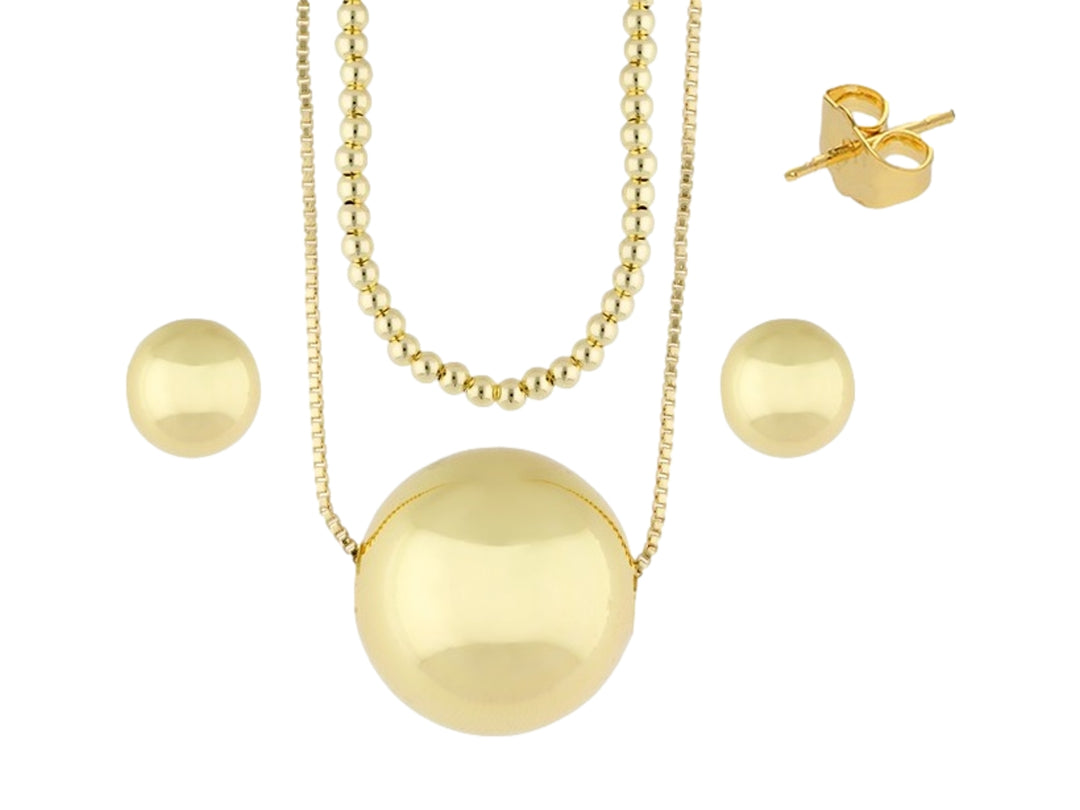 Set de joyería dorado compuesto por un collar con esfera central y aretes a juego en forma de perla.