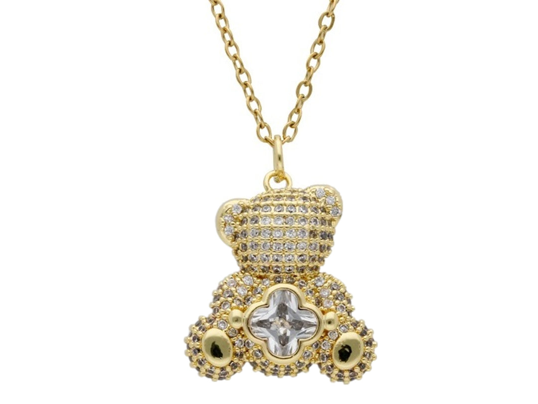 Collar dorado con dije de oso incrustado con brillantes y una piedra central transparente.
