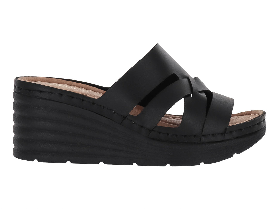 Sandalia de plataforma color negro con tiras cruzadas y suela de cuña.