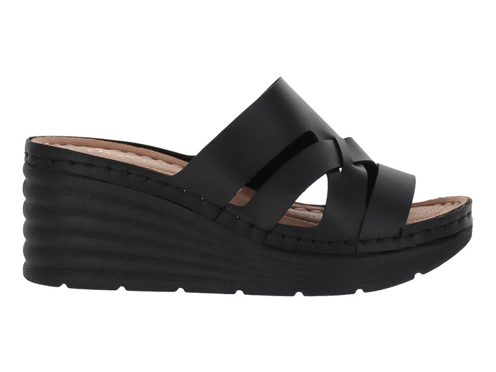 Sandalia de plataforma color negro con tiras cruzadas y suela de cuña.