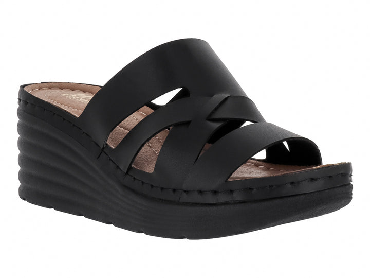 Sandalia de plataforma color negro con tiras cruzadas y suela de cuña.