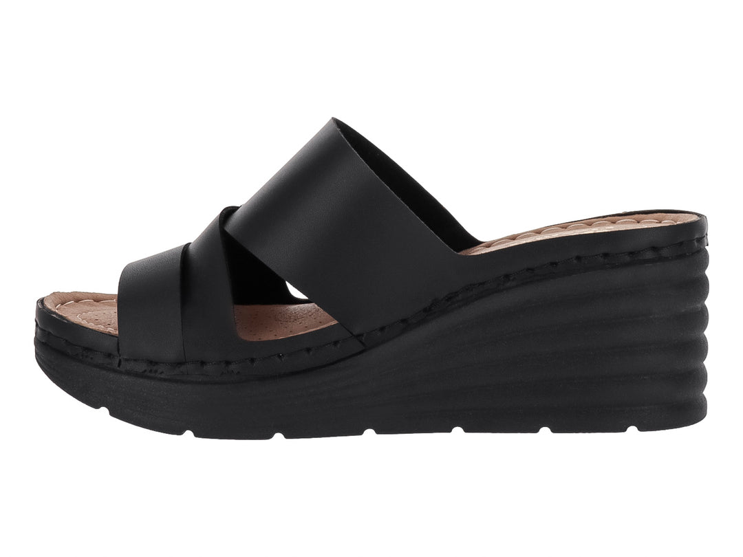 Sandalia de plataforma color negro con tiras cruzadas y suela de cuña.