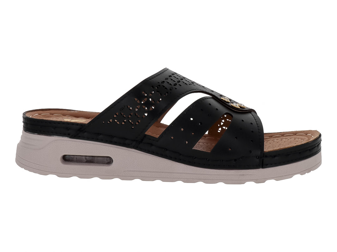 Sandalia Flexmas color negro con suela blanca amortiguada y detalles perforados en la parte superior.