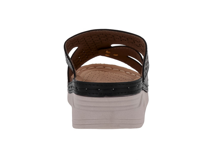 Sandalia Flexmas color negro con suela blanca amortiguada y detalles perforados en la parte superior.