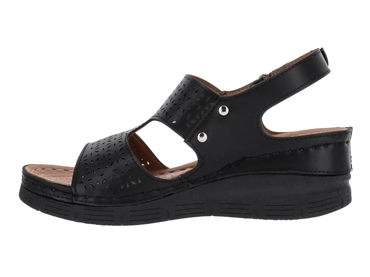 Sandalia negra de plataforma para mujer con detalles perforados y correa ajustable en el tobillo.