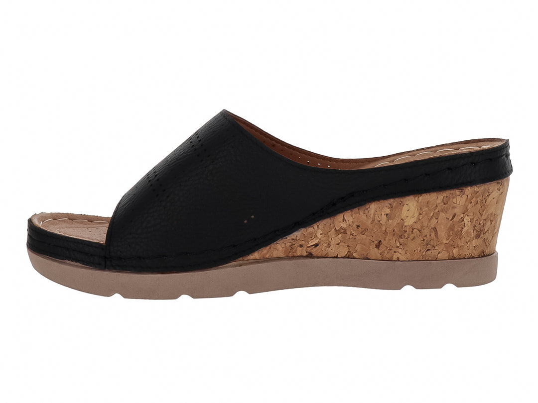 Sandalia negra de cuña con plataforma de corcho y suela beige para mujer.