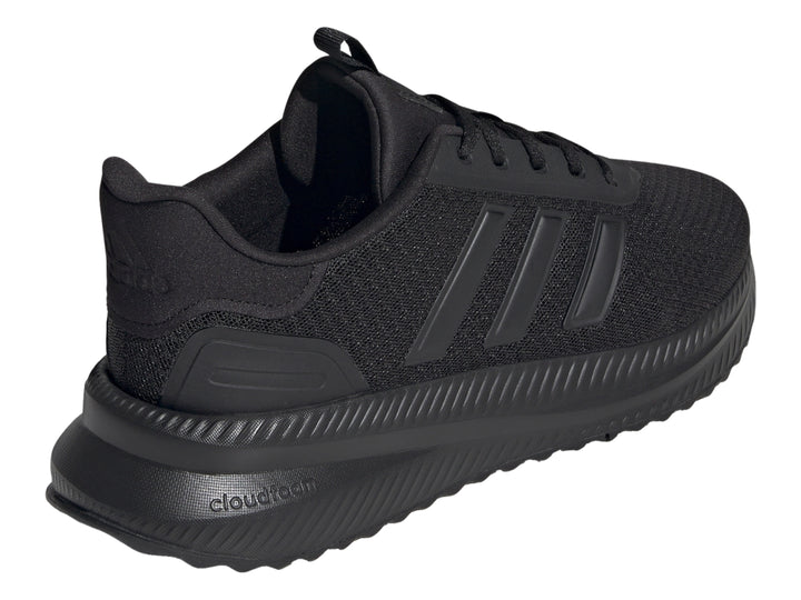 Tenis deportivos Adidas en color negro total, vista lateral.