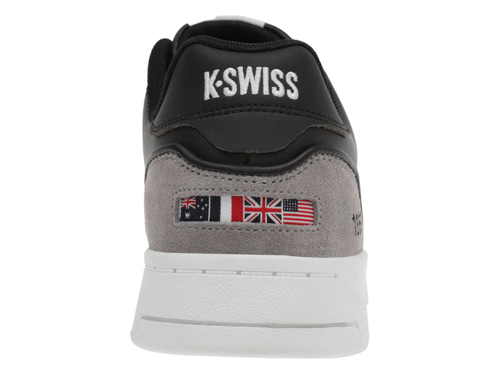 Tenis K-Swiss color negro con suela blanca y detalles en gris.