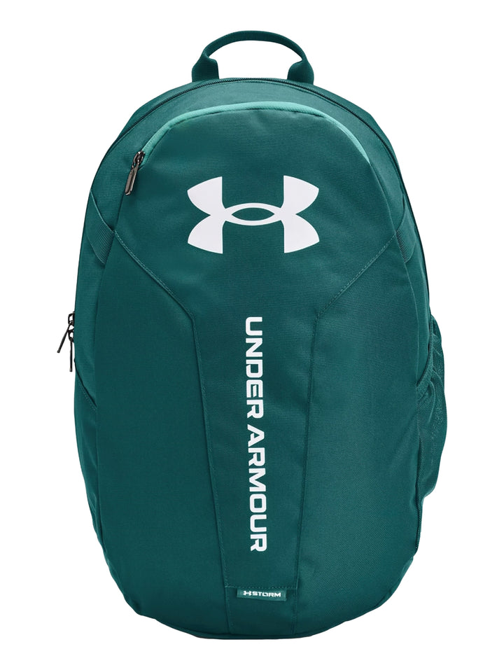 Mochila Under Armour Hustle Lite en color azul con logotipo blanco frontal y asa superior.
