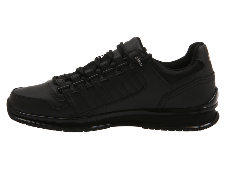 Tenis deportivos K-Swiss en color negro con suela negra y detalles plateados.