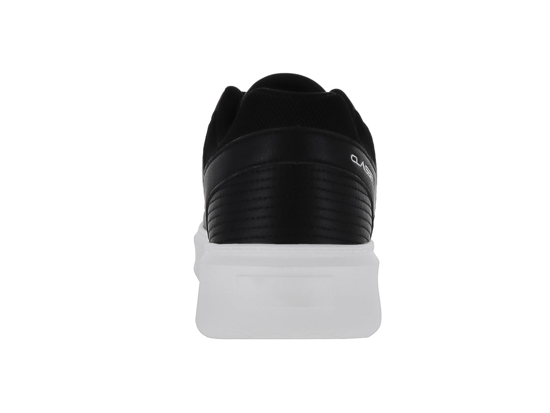 Tenis casuales Clasben color negro con suela blanca gruesa y detalles de costura.