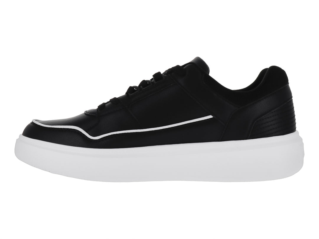 Tenis casuales Clasben color negro con suela blanca gruesa y detalles de costura.