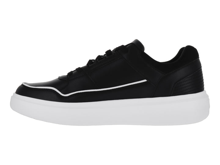 Tenis casuales Clasben color negro con suela blanca gruesa y detalles de costura.
