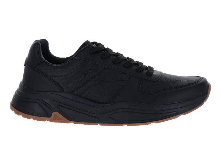 Tenis deportivos Clasben Byron en color negro con suela marrón, diseño moderno y cierre de cordones.