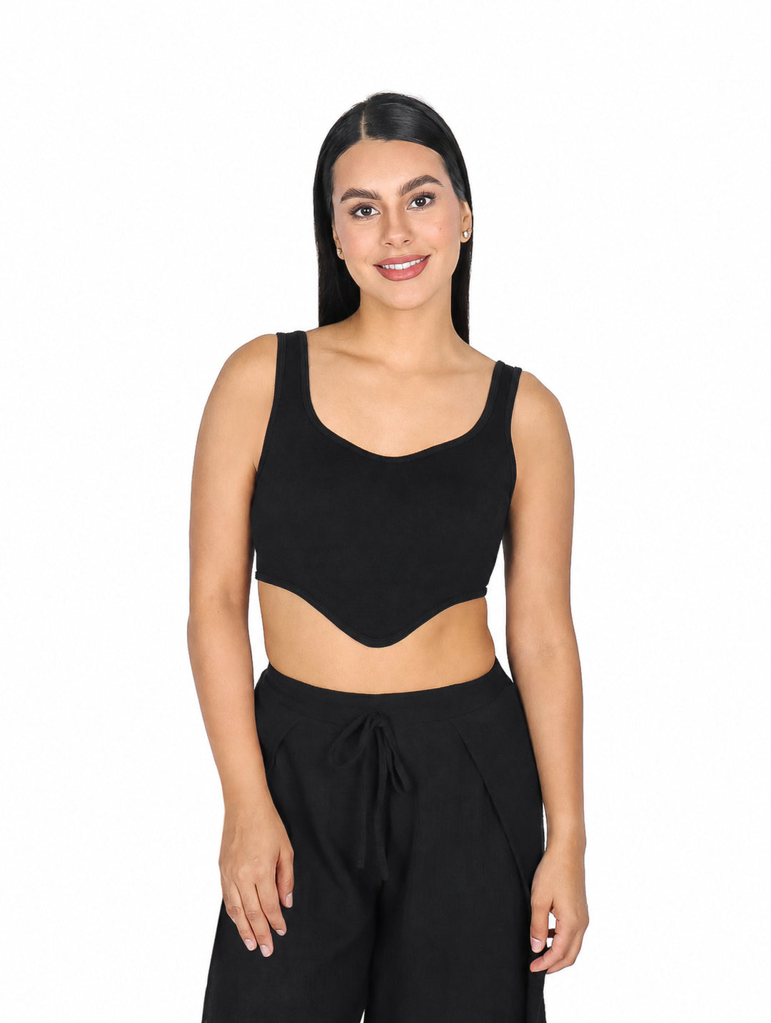 Mujer vistiendo un top tipo corset color negro de la marca ATOK.
