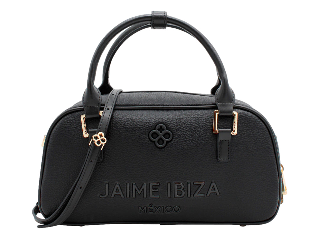 Bolso negro de Jaime Ibiza con forma cilíndrica, detalles dorados y correa ajustable.