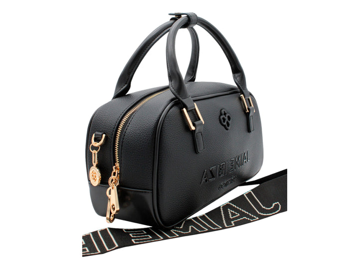 Bolso negro de Jaime Ibiza con forma cilíndrica, detalles dorados y correa ajustable.