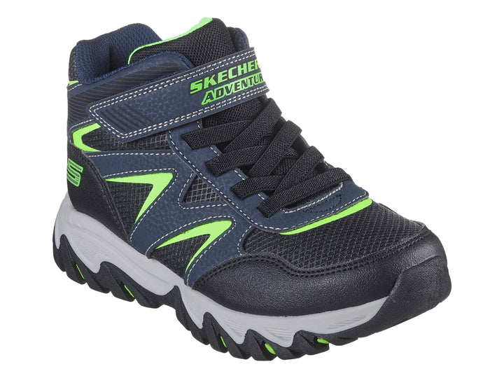 Tenis deportivos Skechers infantiles color azul marino con detalles verde lima y suela gris.