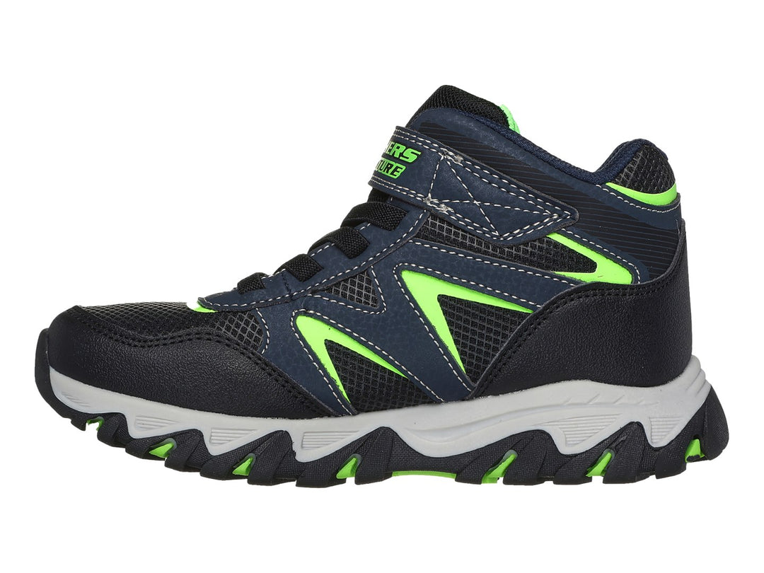 Tenis deportivos Skechers infantiles color azul marino con detalles verde lima y suela gris.