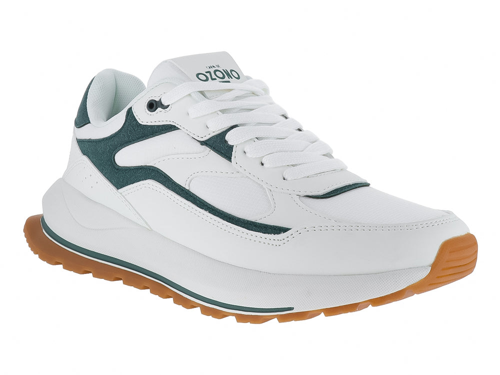 Tenis blancos con detalles en verde y suela de goma marrón.