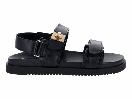 Sandalias Steve Madden Mona de cuero negro con plataforma y detalles dorados en las hebillas.