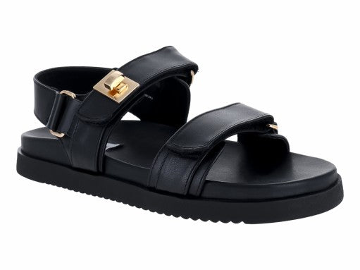 Sandalias Steve Madden Mona de cuero negro con plataforma y detalles dorados en las hebillas.