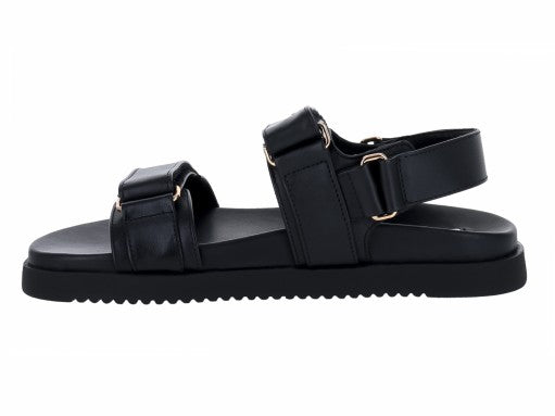 Sandalias Steve Madden Mona de cuero negro con plataforma y detalles dorados en las hebillas.