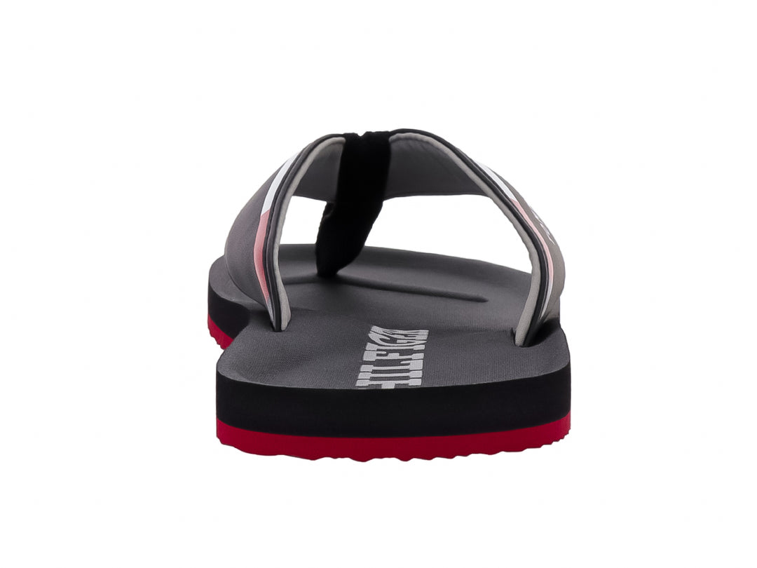 Sandalias Tommy Hilfiger color negro con suela inferior roja y logotipo blanco en la correa.
