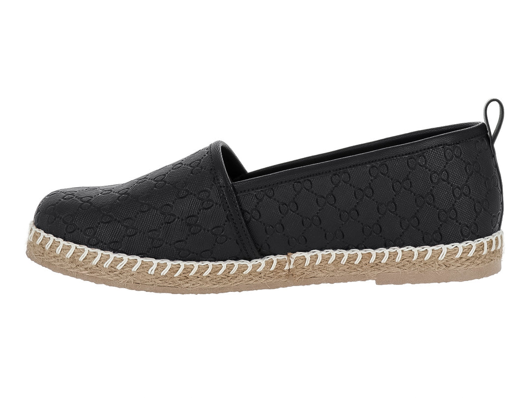 Zapato tipo alpargata color negro con suela de yute y costuras blancas decorativas.