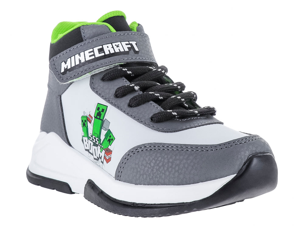 Tenis deportivos infantiles de color gris y blanco con temática de Minecraft, cierre de cordones y correa superior.