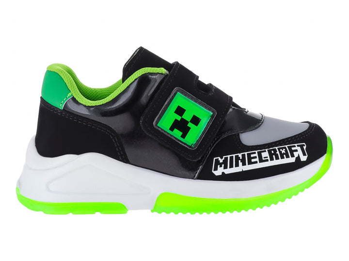 Tenis deportivos negros para niño con detalles en verde neón y blanco, con diseño inspirado en Minecraft.