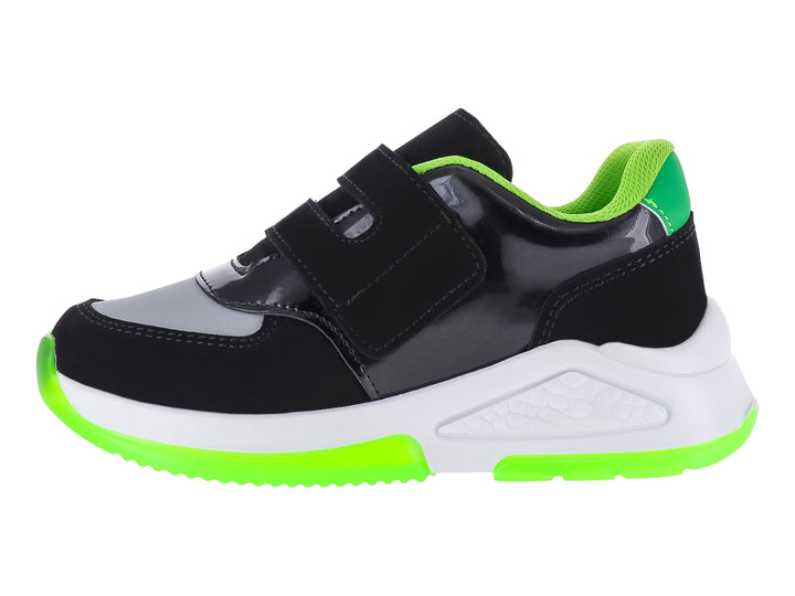 Tenis deportivos negros para niño con detalles en verde neón y blanco, con diseño inspirado en Minecraft.