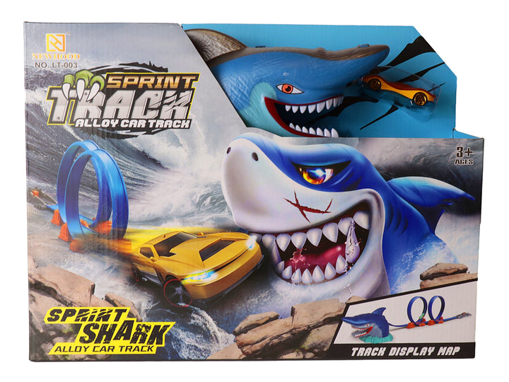 Juego de pista de carros con un tiburón azul gigante y un auto amarillo, empaquetado en caja.