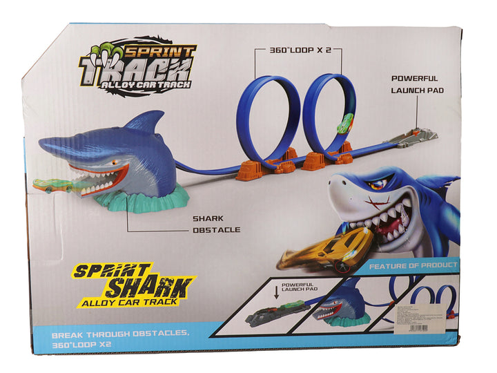 Juego de pista de carros con un tiburón azul gigante y un auto amarillo, empaquetado en caja.