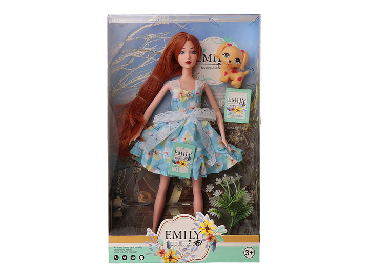 Muñeca Emily con vestido azul floral, cabello rojo y un pequeño perro amarillo en su empaque original.