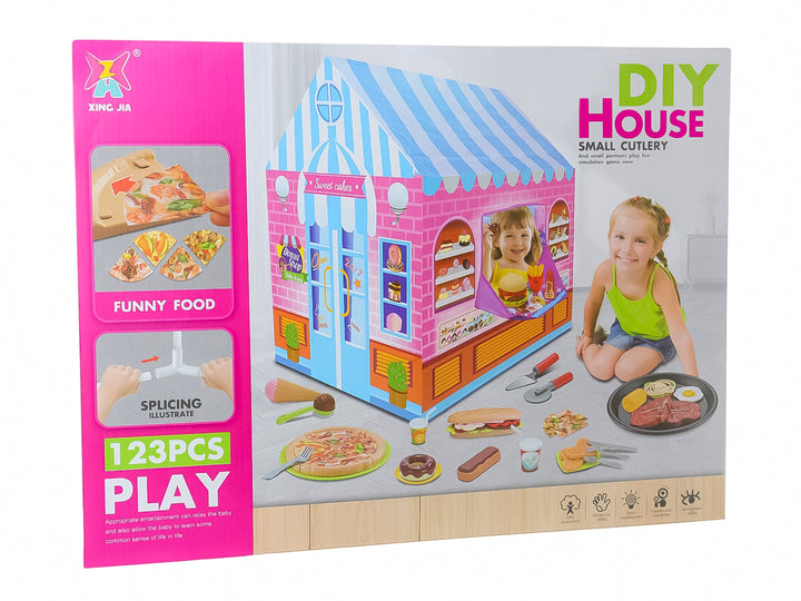 Set de juguete de tienda en casa de campaña multicolor con accesorios de comida y utensilios para niños.